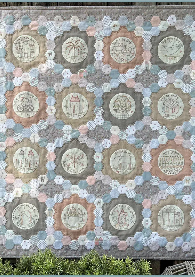 anni-downs-around-town-patron-quilt-stitchery-hexagones-32x36 image 1