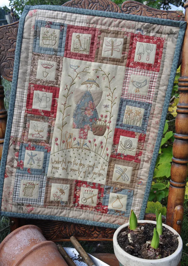 anni-downs-wall-hangings-peaceful-garden-suspension-murale-ange image 1